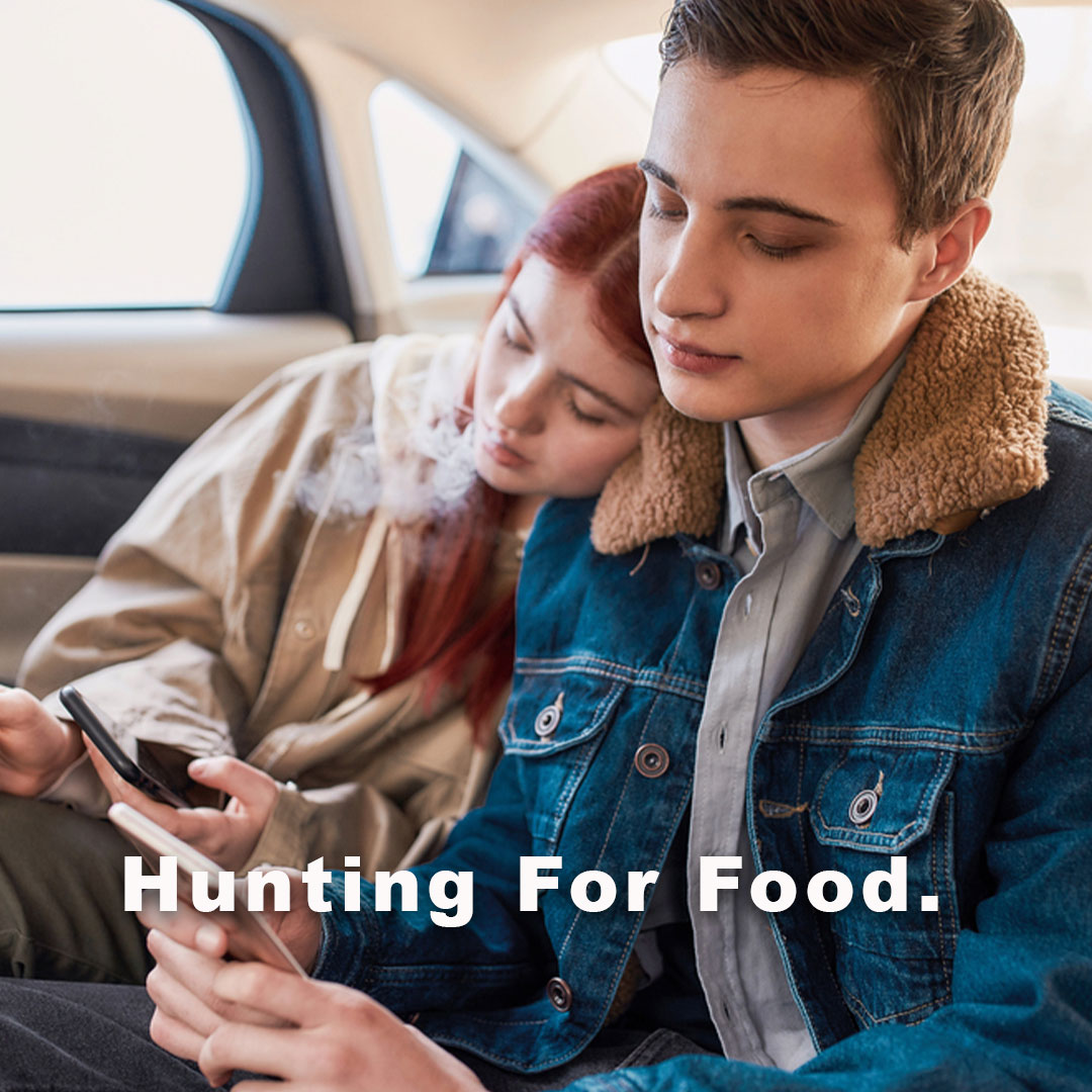 Diners using smartphone to search for nearby restaurants